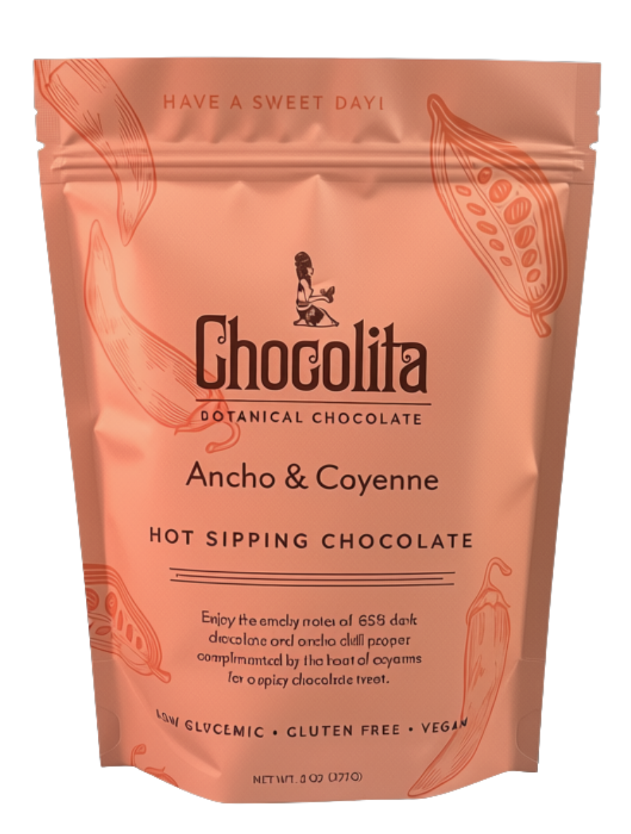 A peach-colored pouch labeled “chocolita.com Ancho & Cayenne Sipping Chocolate” with cocoa pod illustrations evokes the tradition of Mayan chocolate. The text highlights this dark, spicy hot chocolate as low glycemic, gluten free, and vegan.
