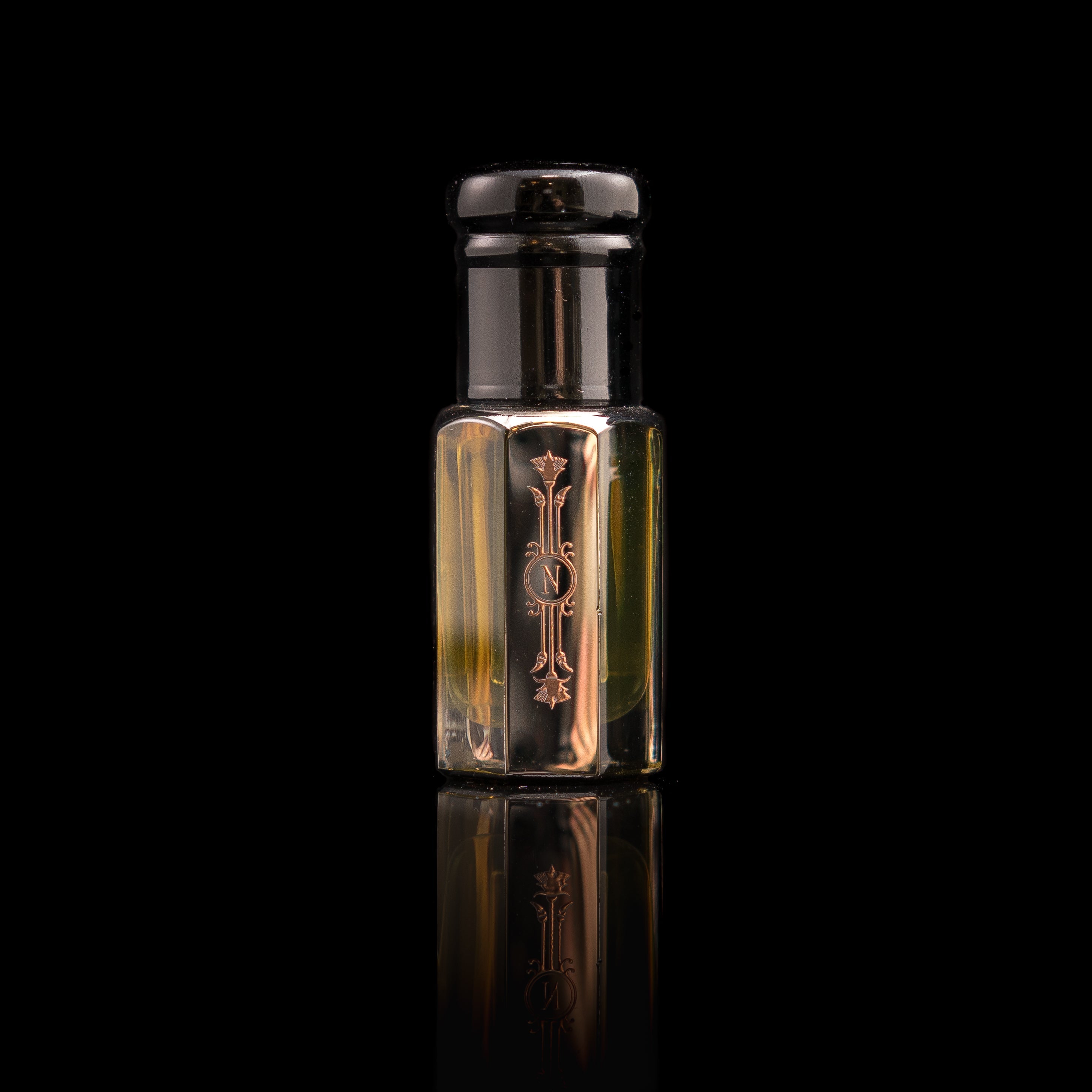 Fatimah's Secrets by Nefertem Perfume Co. is a small, elegant glass bottle with a dark cap and gold decorative design and lettering on the front, evoking an exotic oriental fragrance against a black reflective background.