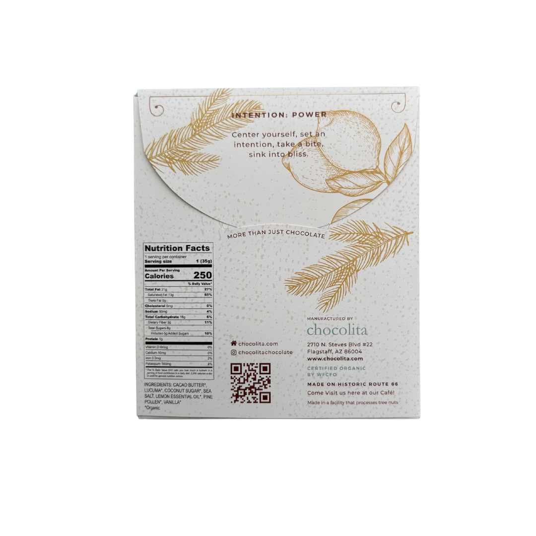 Back of a POWER- Pine Pollen & Lemon bar by chocolita.com, showing nutrition facts, QR code, company contacts, gold botanical art with Attention: Power, and a mindfulness message at the top.